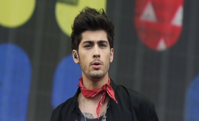 ช็อค'เซย์น มาลิค'โบกมือลา'One Direction'